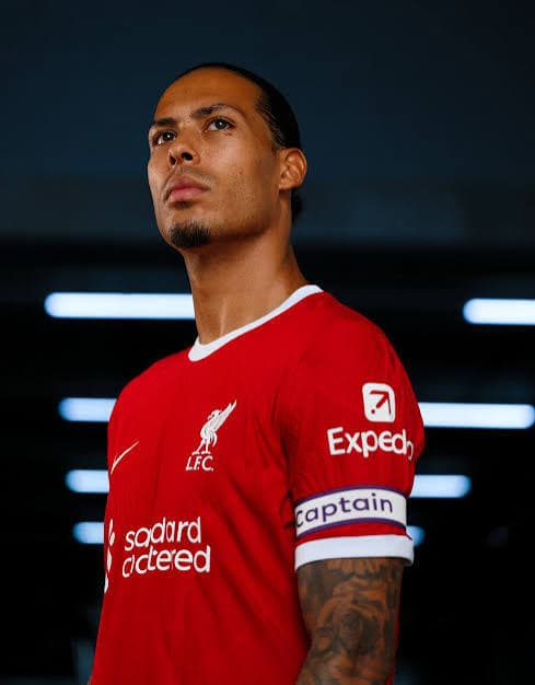 Virgil van Dijk in a Liverpool red home shirt commanding the defensive line — Netherlands captain and FPL premium defender rated high fatigue risk for GW1 2026/27